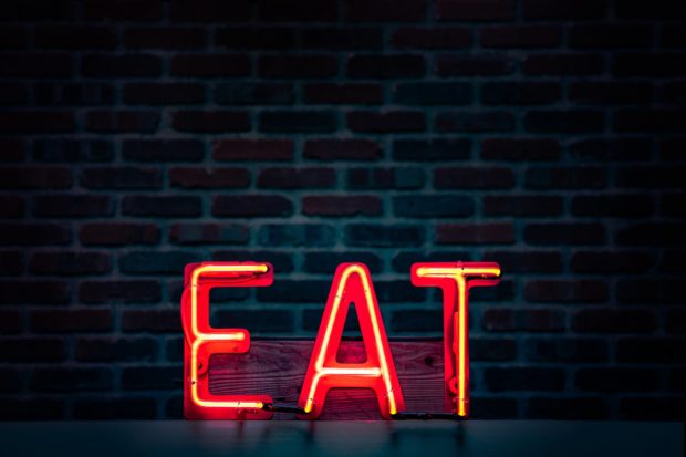 red eat neon sign turned on
