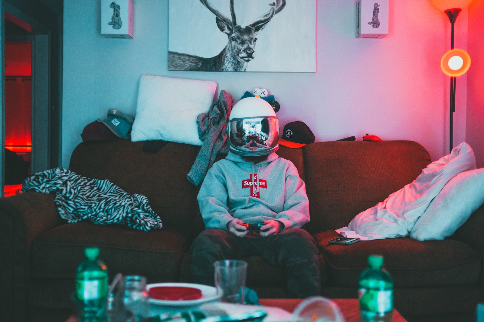 Boy in virtual reality helmet playing joystick