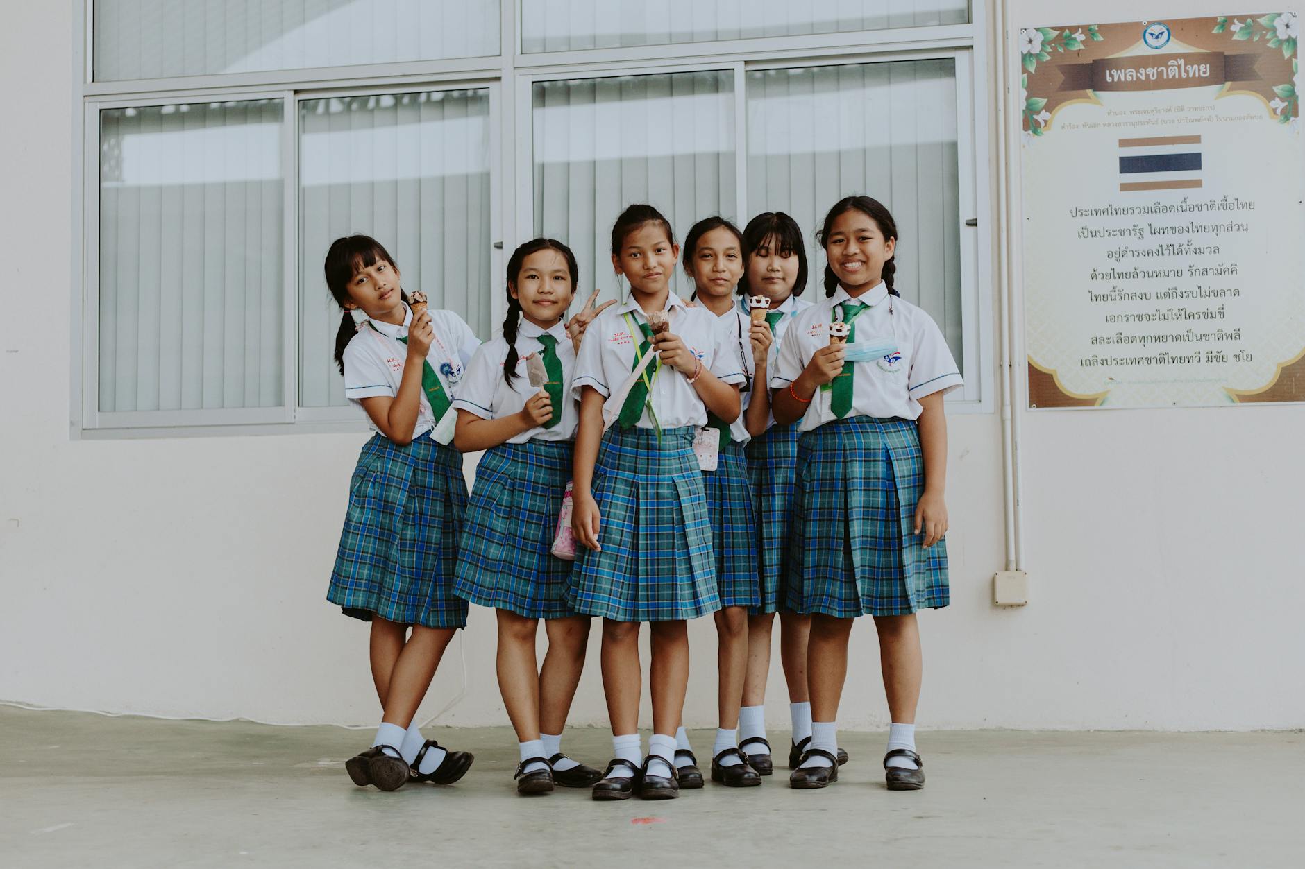 portrait of girls in school uniforms with ice cream