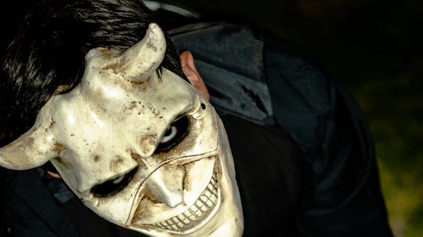 creepy person wearing a skull mask